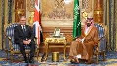 Then-UK Prime Minister Keir Starmer sits on the left of the picture with Saudi Crown Prince Mohammed bin Salman on the right in Jeddah, Saudi Arabia