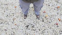 Volunteers clear washed-up bags of chips from beach