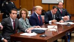 Donald Trump in court wit im lawyers, including Todd Blanche (far left) and Susan Necheles (second from left)