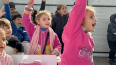 Children study in a classroom in Gaza