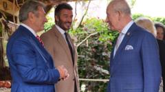 King all smiles as he meets David Beckham at Chelsea Flower Show