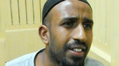 The sister of a schoolboy stabbed to death in a mistaken identity hit appeals to the fugitive.