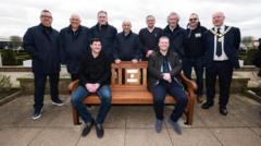 Football legends unveil 100th memorial bench