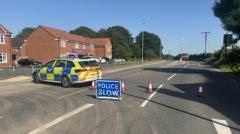 Road closed as fire crews deal with building fire