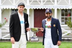 New Zealand's captain Tim Southee (L) and Sri Lankas captain Dimuth Karunaratne pose with the Test Series trophy