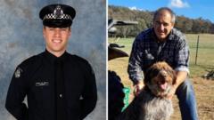 Police killed in Australia shooting named as manhunt continues