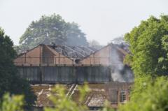 Firefighters and member of public die in blaze at business park