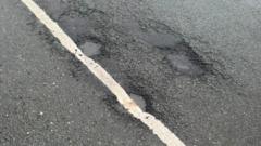 Potholes 'painted over' by council with road markings 