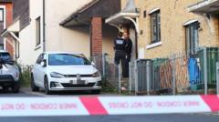 Boy and woman still in custody as murder probe continues