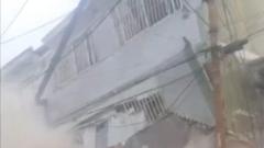 Chaos after building collapses on Caracas outskirts