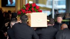 Football 'Picasso' John Robertson honoured at funeral