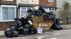 Rubbish piles high in city as bin strike drags on