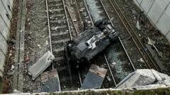 Mainline closed after car crashes on to railway