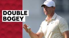 McIlroy drops two shots on penultimate hole