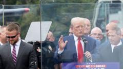 Watch: Trump speaks behind bullet-proof glass at rally