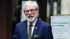 Gerry Adams takes the stand over claims he had role in IRA bombings