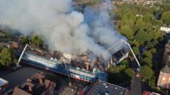 Girls aged 13 and 14 arrested after fire destroys historic hotel
