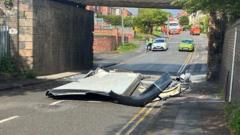 Double decker's roof torn off by low bridge