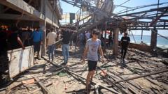 Israeli strike on Gaza seafront cafe kills at least 20 Palestinians, witnesses and rescuers say