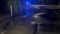Busy route closed as burst water main damages road