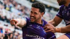 Huddersfield beat 12-man Hull for first win