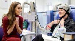 Kate tells of 'tough' cancer treatment during hospital visit