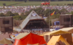A photo shows the pyramid stage at Glastonbury Festival.