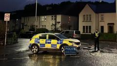 Man arrested after woman found dead following flat fire