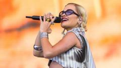 Organisers ease concern of clash between World Cup final warm-ups and Rita Ora set