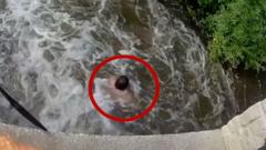 Man rescued after being swept under bridge in swollen Wisconsin river