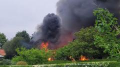 'Explosions' heard during village building fire