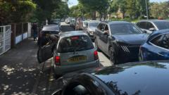Emergency vehicles impeded by cars parked near beach