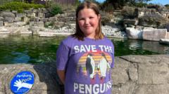 The swimming kids helping penguins make a splash