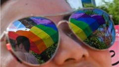 Every year tens of thousands of pipo dey attend LGBT rights rally Pink Dot for Singapore 