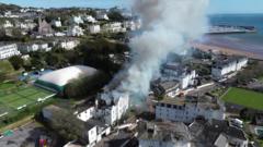 Derelict hotel fire sends smoke across town