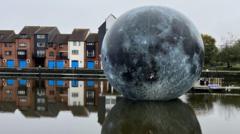 Fallen Moon art installation deflates due to high winds