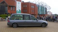 Tributes as John Clark's cortege passes Celtic stadium
