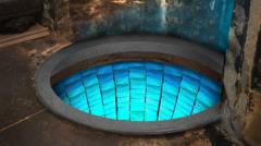 Hidden well in cathedral crypt shines blue after mosaic transformation
