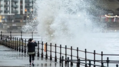 Homes flooded and weather warnings in place on New Year's Day