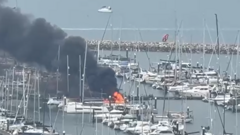 Yachts fire sends thick smoke into port