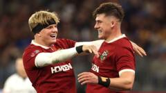 Lions captain Dan Sheehan (right) celebrates his try with Henry Pollock