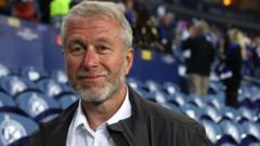 UK threatens to sue Roman Abramovich over Chelsea sale