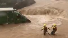 Watch: Drivers rescued after floodwaters cause chaos in Spain