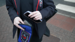 School phone bans not enough to cut screen time alone, researchers say