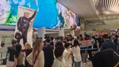 South Korean workers detained in US raid arrive home