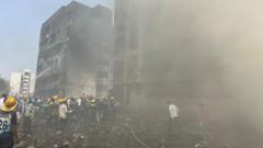 Watch: BBC correspondent at the scene as rescuers work among wreckage