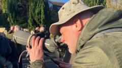 Crowds flock to quiet cul-de-sac after rare bird spotted on washing line