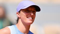 Swiatek inspired by Nadal as title defence begins