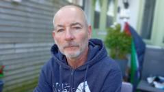 Deported flotilla activist from Belfast returns home