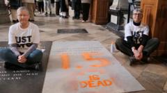 Arrests after Charles Darwin grave spray-painted by climate protesters